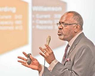 Connie Hathorn, superintendent of Youngstown city schools, presents his plan to a large crowd at the board
of education offices Wednesday.