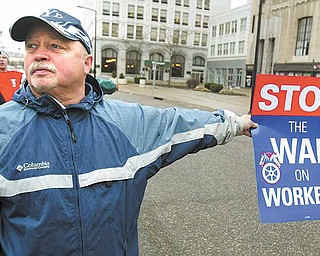 Youngstown firefighter Joe Caraballo joined more than 400 protesters Wednesday afternoon in opposition to the Youngstown/Warren Regional Chamber’s endorsement of Senate Bill 5. The protest was outside the chamber’s headquarters downtown. The bill was sent to the governor Wednesday night.