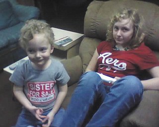 Timmy Kerr, 4, and Kayla Kerr, 14, play the Wii while waiting for warmer weather. They're both from Poland. Photo submitted by Gary Kerr.