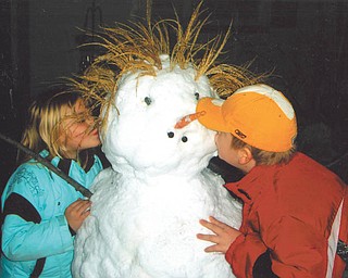 Barbara Kukla of Boardman sent us this picture of her niece and nephew, McKenna and Justin Kukla, 6 and 8, respectively, of New Middletown. When classes at Springfield Elementary School were recently canceled due to the weather, they made it a true snow day by spending the afternoon building a family of snow people. Here, they decided to "kiss winter goodbye."