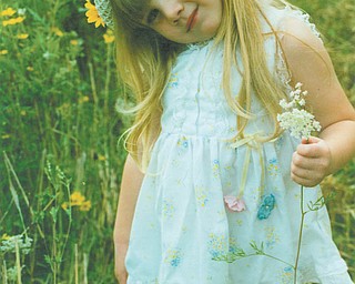 Lana Van Auker of Canfield sent in this photo of Leanna Hartsough at age 4. Leanna, who loves fields and flowers, is now a senior at Canfield High School.