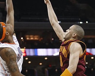 Cleveland Cavaliers' Anthony Parker, right, takes the final shot as time expires as Charlotte Bobcats' Dominic McGuire, left, defends in the Bobcats' 98-97 win in an NBA basketball game in Charlotte, N.C., Wednesday, March 30, 2011.