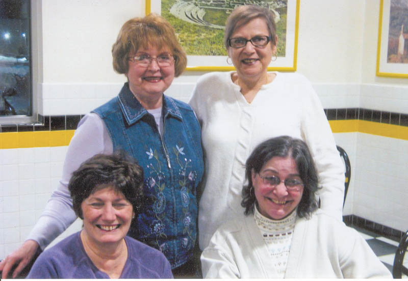 Tri-Gold officers preparing for the group’s annual auction for its scholarship fund are, in front, from left, Sharon Pasquale and Jolyn Bush, and back, Donna Farmer and Mary Ann David. The basket auction will take place April 9 at St Nicholas parish hall in Struthers. 