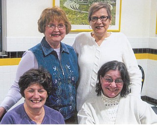 Tri-Gold officers preparing for the group’s annual auction for its scholarship fund are, in front, from left, Sharon Pasquale and Jolyn Bush, and back, Donna Farmer and Mary Ann David. The basket auction will take place April 9 at St Nicholas parish hall in Struthers.