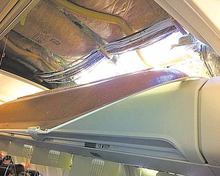In this photo provided by passenger Christine Ziegler, shows an apparent hole in the cabin on a Southwest Airlines aircraft Friday, April 1, 2011 in Yuma, Ariz. Authorities say the flight from Phoenix to Sacramento, Calif., was diverted to Yuma due to rapid decompression in the plane. FAA spokesman Ian Gregor says the cause of the decompression isn't immediately known. But passengers aboard the plane say there was a hole in the cabin and that forced an emergency landing.