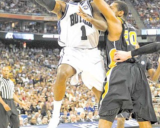 Butler guard Shelvin Mack (1) battles Virginia Commonwealth guard Bradford Burgess (20) during the second half of an NCAA Final Four semifinal at Reliant Stadium in Houston, Texas, Saturday, April 2, 2011.
