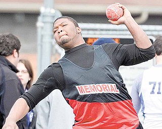 Kejuan Kelly of Campbell Memorial High School compete in the shot put during the Joe Lane Invitational track and field event Saturday at Mineral Ridge High School. McDonald boys finished first with 126 points, and
Mineral Ridge was second with 94.
