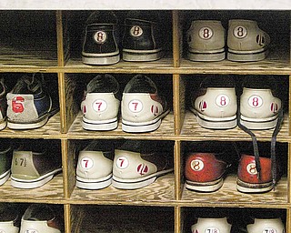 Shoes that likely have been worn by thousands of feet line shelves at Kay Lanes bowling alley in Girard. The long-time business is closing after several years of struggle in a sluggish economy.