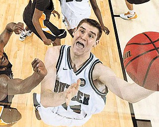 Butler's Andrew Smith shoots as Virginia Commonwealth's Jamie Skeen defends during the first half of a men's NCAA Final Four semifinal college basketball game Saturday, April 2, 2011, in Houston.