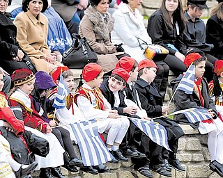 Greek youths gather at the Warren Amphitheater on Sunday to listen to members of the Greek community of Warren give speeches. The event, which also included a parade, took place in recognition of Greek Independence Day.