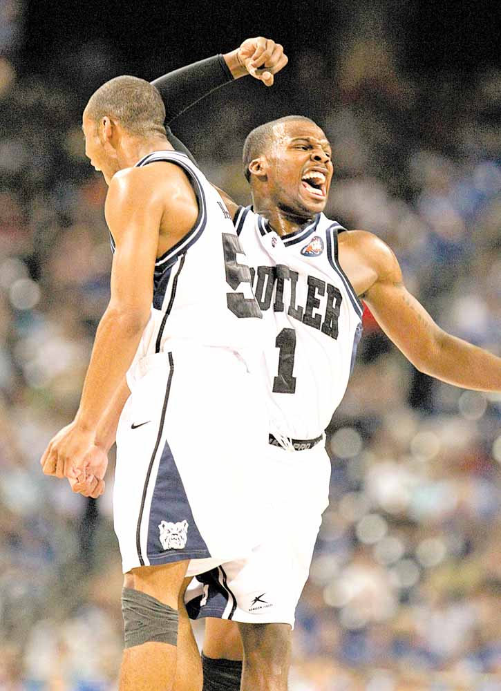 Shelvin Mack of Butler, right, celebrates during second-half action against Virginia Commonwealth in an NCAA Final Four semifinal at Reliant Stadium in Houston, Texas, Saturday, April 2, 2011. Butler beat VCU, 70-62. 