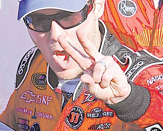 Kevin Harvick. front, celebrates after winning the NASCAR Sprint Cup Series auto race at Martinsville Speedway in Martinsville, Va., Sunday, April 3, 2011.