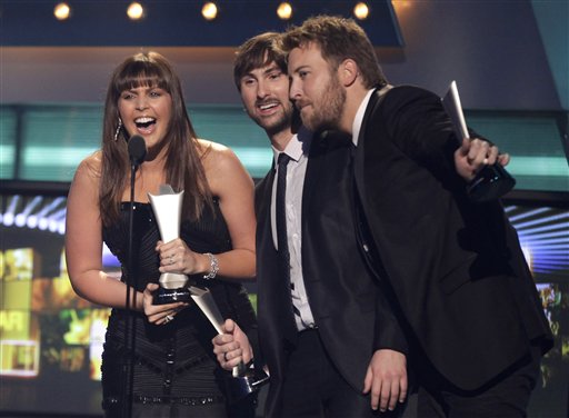 From left, Hillary Scott, Dave Haywood and Charles Kelley, of Lady Antebellum, accept the award for album of the year at the 46th Annual Academy of Country Music Awards in Las Vegas on Sunday, April 3, 2011. 