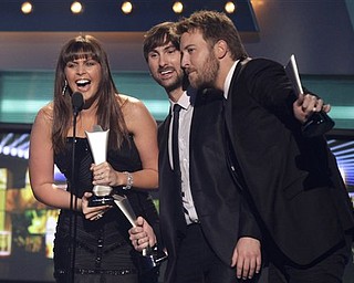 From left, Hillary Scott, Dave Haywood and Charles Kelley, of Lady Antebellum, accept the award for album of the year at the 46th Annual Academy of Country Music Awards in Las Vegas on Sunday, April 3, 2011.