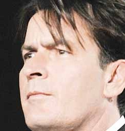 In this Sunday, Aug. 17, 2008 picture, Charlie Sheen poses backstage at the 2008 ALMA Awards in Pasadena, Calif. Sheen's spokesman says the actor's two young daughters are doing fine after a Mercedes-Benz sports utility vehicle they were riding in collided with a sedan on Pacific Coast Highway on Friday, Dec. 12, 2008, sparking a multi-vehicle crash that sent one person to the hospital.
