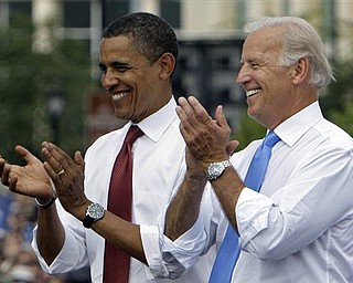 In this Aug. 23, 2008 file photo, Democratic presidential candidate Sen. Barack Obama D-Ill., and his vice presidential running mate Sen. Joe Biden D-Del. applaud at a campaign stop in Springfield, Ill. President Obama formally launched his re-election campaign Monday, April 4, 2011, urging grass-roots supporters central to his first White House run to mobilize again to protect the change he's brought over the past two years.