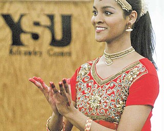 Youngstown State University student Meena Thatikunta gives a presentation titled “Sustaining the Relevance of Bharata Natyam in Contemporary Society” during a Quest event at the university. Bharata Natyam is a form of Indian dancing.