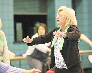 Eve Bevilacqua, Mahoning Valley fitness instructor and personal trainer, leads a “Well of Body” program at the Ursuline Center in Canfield. She advised participants Tuesday to “keep moving” and maintain a positive attitude.