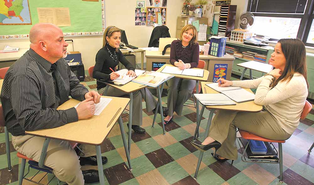 Boardman Glenwood teachers, from left, Bill Coler, Lisa Kutchel, Kathi Rothman and Jenn Dravecky, make up Gray 5, one of the team-teaching groups instituted this year. The teachers meet regularly to discuss lesson plans, student performance and behavioral issues.