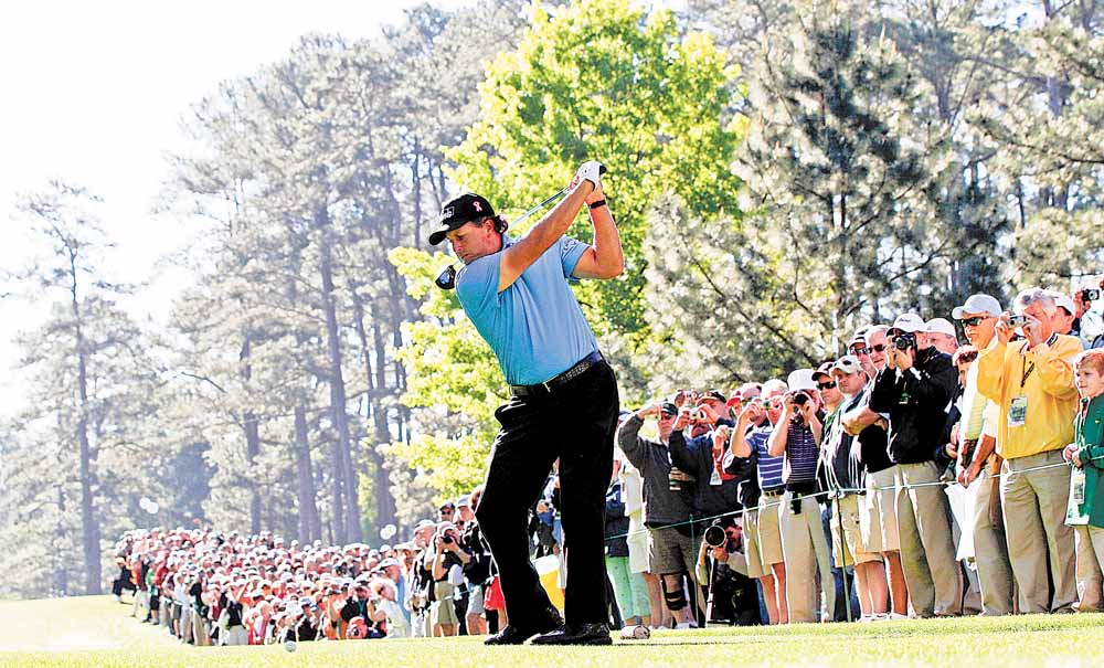 Phil Mickelson tees off on the seventh hole during a practice round for the Masters golf tournament Wednesday, April 6, 2011, in Augusta, Ga. 