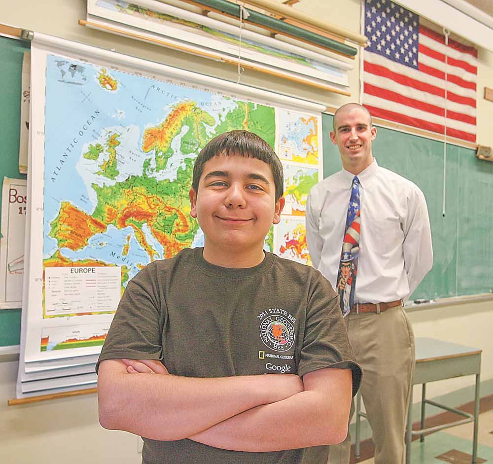 Four-time Boardman Glenwood Geography Bee champion Michael Palagano advanced all the way to the final round of the state bee last Friday before he was defeated on a sudden-death overtime question. Palagano credits his success to his father, Michael, and social studies teacher Vince Carnevale, pictured, who helped him study throughout his middle school years.