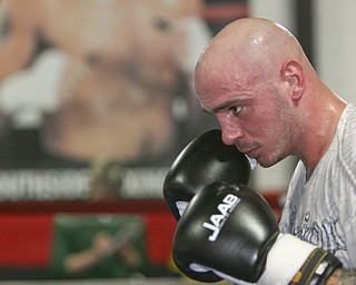 Kelly Pavlik is back in the ring, sparring Romaro Johnson, and conditioning for his upcoming bout in May. He's pictured here in at Jack Loew's South Side Boxing Club in Youngstown.