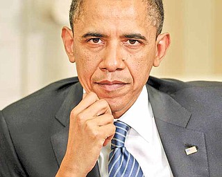 President Barack Obama is seen in the Oval Office of the White House in Washington, Thursday, April 7, 2011, during his meeting with Colombian President Juan Manuel Santos. (AP Photo/Pablo Martinez Monsivais)
