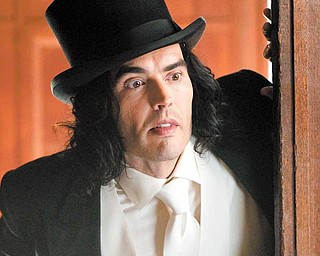 In this film publicity image released by Warner Bros. Pictures, Russell Brand is shown in a scene from "Arthur." (AP Photo/Warner Bros. Pictures, Barry Wetcher)