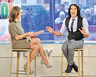 In this photo released by NBC, "Today" show co-host Meredith Vieira talks with actor Russell Brand on the "Today" show about his new movies "Hop" and "Arthur," Wednesday, March 30, 2011, in New York. (AP Photo/NBC, Peter Kramer) NO SALES