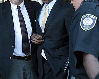 Former baseball player Barry Bonds, center, leaves federal court in San Francisco, Thursday, April 7, 2011. Bonds is charged with three counts of lying to a grand jury in 2003 and a count of obstruction for denying that he knowingly took performance-enhancing drugs and for saying no one other than his doctors gave him an injection. (AP Photo/Jeff Chiu)
