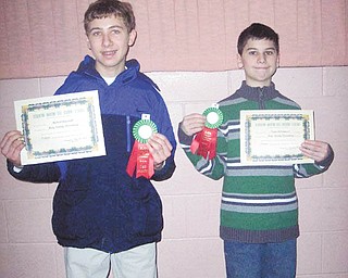 Parla italiano? Sì: Michael Angiolelli, at left, and Victor DiTommaso, both students at Holy Family School in Poland, came up winners at the 35th annual Italian Language Contest on March 12 at Youngstown State University. Michael took first place at the eighth-grade level for his poem “Carnivale,” and Victor won first prize at the fifth-grade level for his poem “Il Febbraio.” Nearly 200 high school and elementary students who are studying Italian participated.