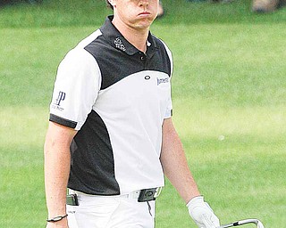 Rory McIlroy of Northern Ireland reacts to his shot that nearly rolled in the water on the 15th hole during the second round of the Masters golf tournament Friday, April 8, 2011, in Augusta, Ga. (AP Photo/David J. Phillip)