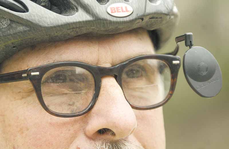 Paul Kobulnicky of Poland, a librarian at Youngstown State University’s William F. Maag Library, gets ready to ride his bicycle. The city of Youngstown has a new map to show riders the easiest, moderate and hardest bicycle routes through city streets.