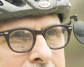 Paul Kobulnicky of Poland, a librarian at Youngstown State University’s William F. Maag Library, gets ready to ride his bicycle. The city of Youngstown has a new map to show riders the easiest, moderate and hardest bicycle routes through city streets.