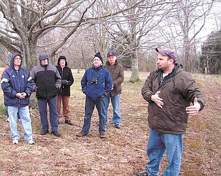 In Antietam’s West Woods, from left,  Rock Basciano of Warren, Merle Linsenbigler of Vienna, Ruth Ann 
Linsenbigler of Vienna, Mike Cummings of Hermitage, Pa., and Mike Miller of Vienna listen to tour guide 
John Hoptak. 
