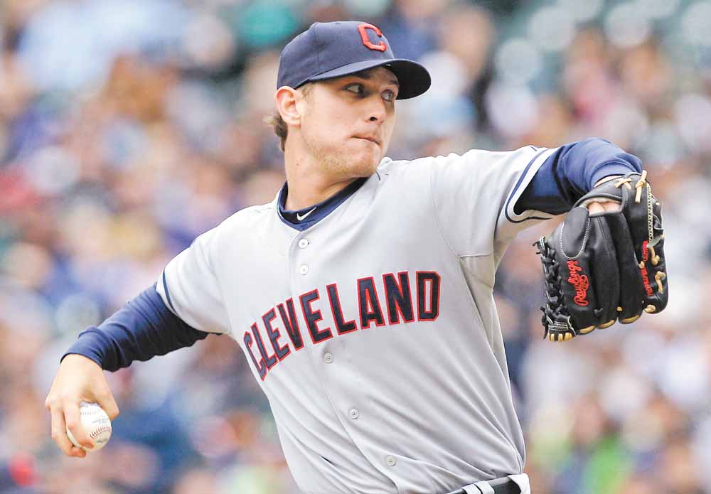 Cleveland Indians starting pitcher Josh Tomlin throws against the Seattle Mariners in the first inning of a baseball game Sunday, April 10, 2011, in Seattle. 