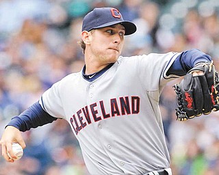 Cleveland Indians starting pitcher Josh Tomlin throws against the Seattle Mariners in the first inning of a baseball game Sunday, April 10, 2011, in Seattle.