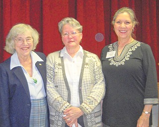 Background reviewed: Lea Mollman, in center, registrar for the Mahoning Valley Historical Society, spoke on “Greystone Throughout the Years” at a recent meeting of the American Association of University Women, Warren-Trumbull Branch. After chronicling the history of Greystone, now known as the Arms Family Museum, she was joined by, from left, Martha Ellers, program chairwoman, and Isabel Seavey, AAUW president. For information on becoming a member, call 330-898-3696.