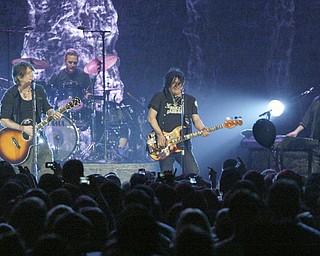 Guitarist John Rzeznik, left, and bassist Robby Takac of the Goo Goo Dolls perform at The Covelli Centre Tuesday, 4-12-11.