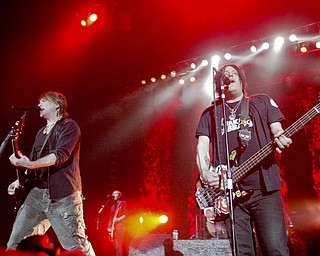 Guitarist John Rzeznik, left, and bassist Robby Takac of the Goo Goo Dolls perform at The Covelli Centre Tuesday, 4-12-11.