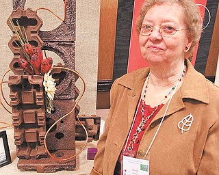 More than 175 attended the Garden Club of Ohio’s convention Tuesday in Boardman. Sheila Bowman stands next to the overall winner, submitted by the Center of Industry and Labor.