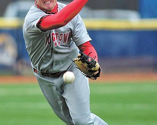 Youngstown State pitcher Padraic Williams makes the throw to first during Tuesday’s game at Kent State.