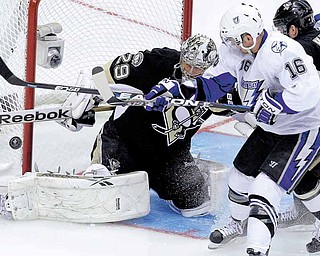 Pittsburgh Penguins goalie Marc-Andre Fleury (29) blocks a shot by Tampa Bay Lightning's Teddy Purcell (16) in the first period of Game 1 of a first-round NHL hockey playoff series in Pittsburgh, Wednesday, April 13, 2011. (AP Photo/Gene Puskar)