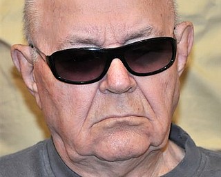 In this Tuesday Aug. 3, 2010 file picture, accused Nazi death camp guard John Demjanjuk arrives in a courtroom in Munich. The FBI believed the Soviets "quite likely fabricated" evidence central to the prosecution of Demjanjuk, according to newly declassified documents from the 1980s _ a revelation that could help the defense as closing arguments resume Wednesday, April 13, 2011 in the retired Ohio auto worker's Nazi war crimes trial in Germany. The FBI field office report, obtained by The Associated Press, casts doubt on the authenticity of this Nazi ID card that is the key piece of evidence in allegations that Demjanjuk served as a guard at the Sobibor death camp in occupied Poland. 