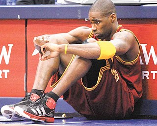 Cleveland Cavaliers power forward Antawn Jamison (4) sits in front of the scorer's tables waiting to be subbed in during the first half of the NBA basketball game against the Dallas Mavericks in Dallas, Monday, Feb. 7, 2011. (AP Photo/LM Otero)
