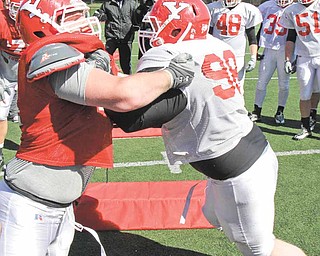 Youngstown State defensive tackle D.J. Moss (98) blocks during a recent spring practice at YSU’s Stambaugh Stadium.