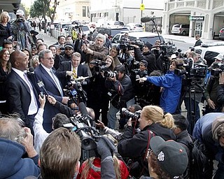 Barry Bonds, left, and his attorney Allen Ruby face the media outside a federal court building Wednesday, April 13, 2011, in San Francisco. The former baseball player was convicted of one count of obstruction of justice. The jury failed to reach a verdict on the three counts at the heart of allegations that he knowingly used steroids and human growth hormone and lied to a grand jury about it. (AP Photo/George Nikitin)