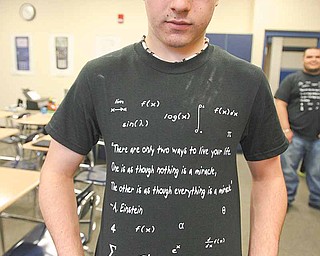 Thomas Merva, a pre-calculus student of the late Michael “Mickey” Soroka, shows one of 300 shirts Soroka’s students designed as a tribute to the Campbell teacher. They are selling the shirts for $7 each and have raised about $400 so far. They will use the money for a memorial.