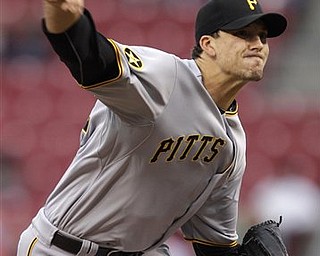 Pittsburgh Pirates starting pitcher Charlie Morton throws against the Cincinnati Reds in the first inning of a major league baseball game, Friday, April 15, 2011 in Cincinnati. (AP Photo/Al Behrman)