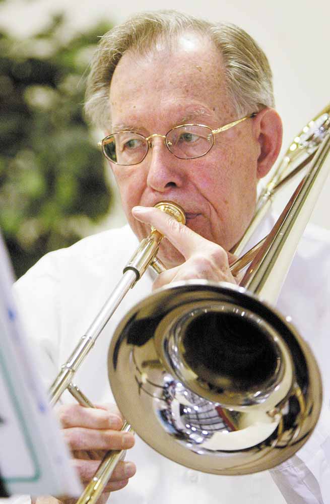 Bill Carson plays trombone with the Dixie Dandies.